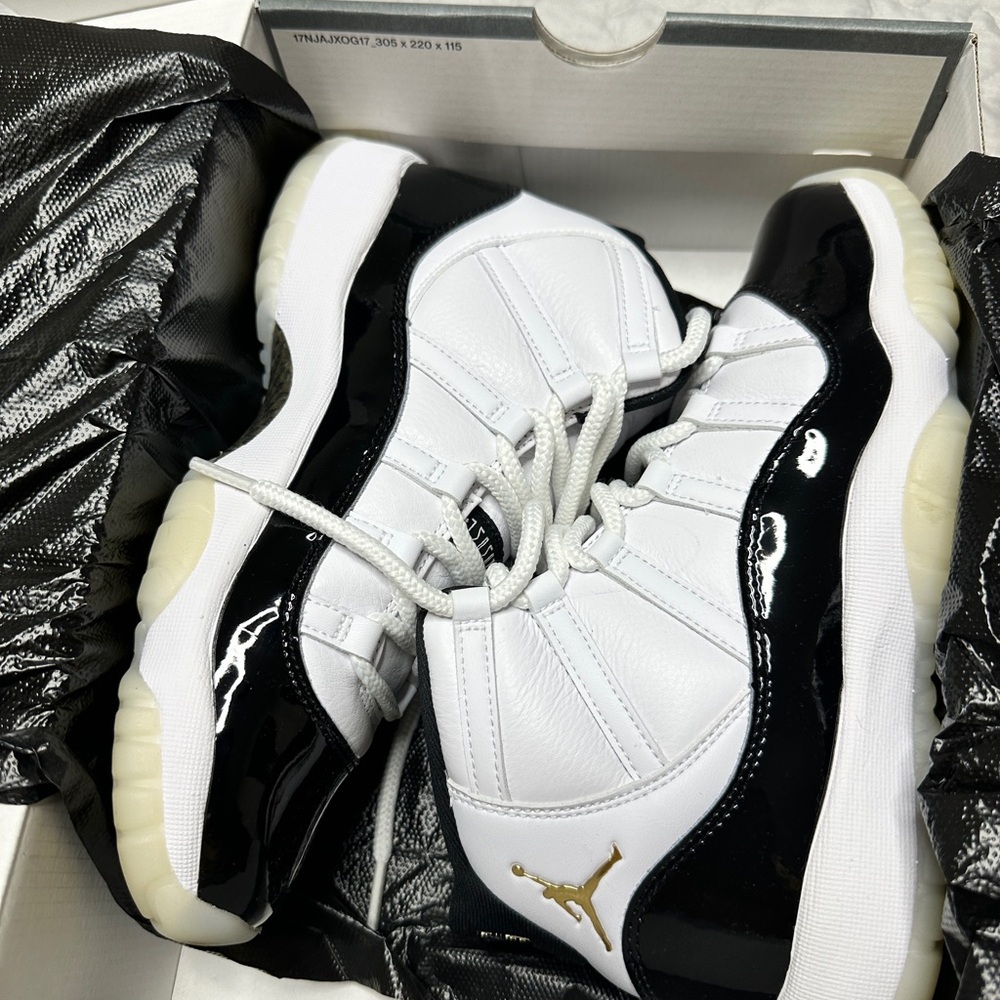 Air Jordan 11 Retro White and Black Sneakers